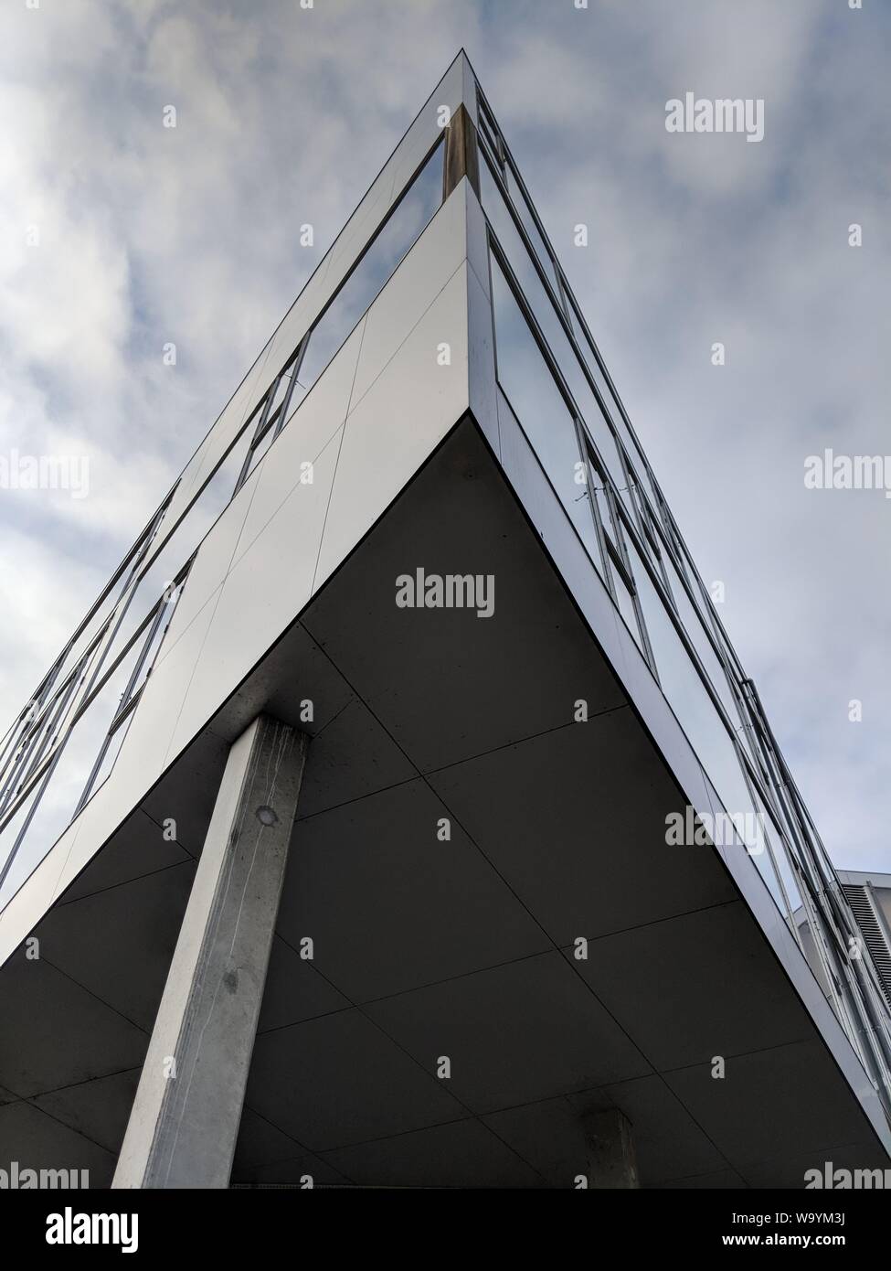 Vertical low angle shot of a high rise triangular building Stock Photo