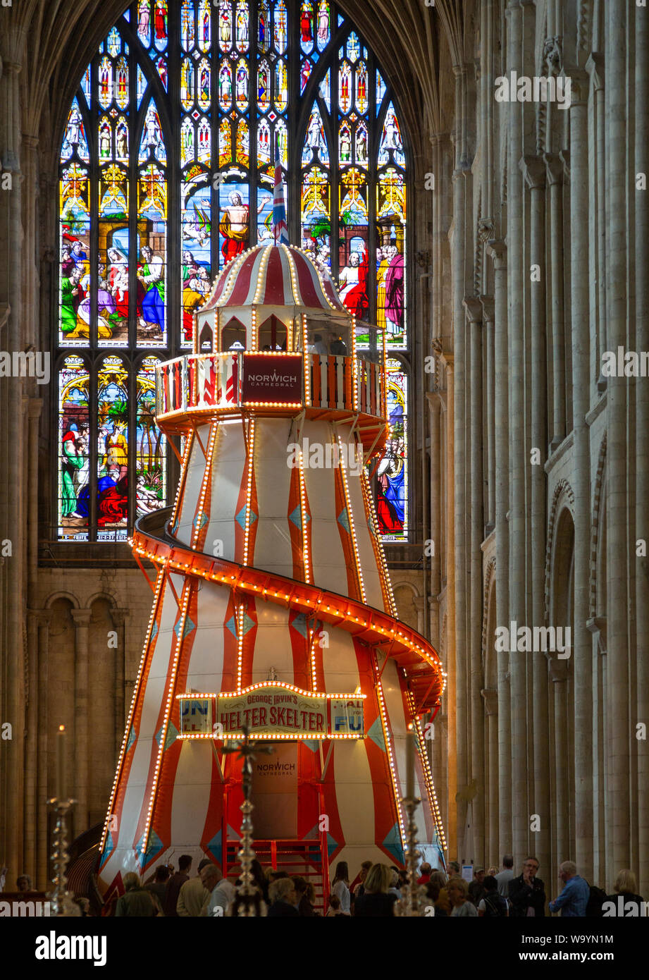 Traditional helter skelter fairground ride inside cathedral church at