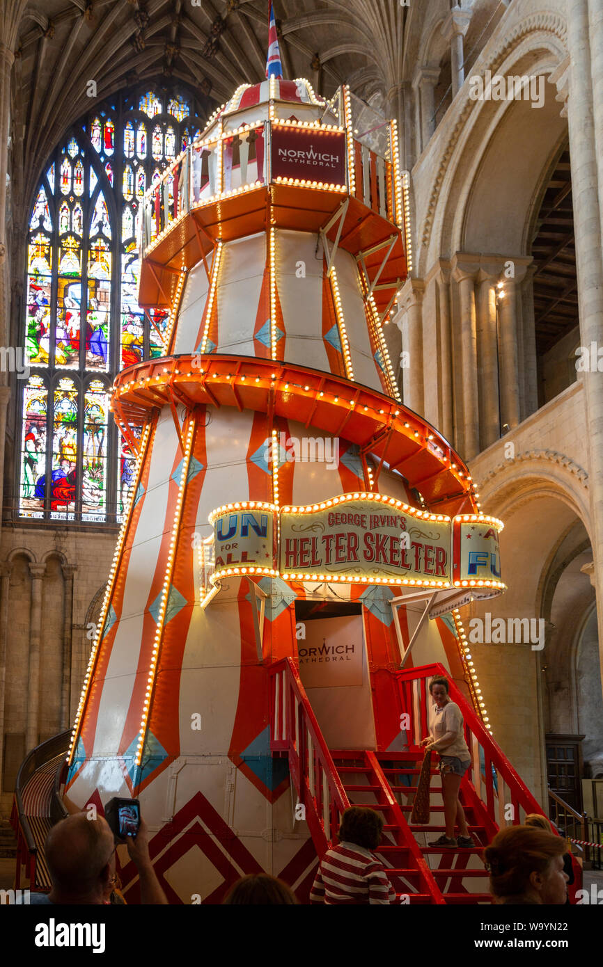 Traditional helter skelter fairground ride inside cathedral church at ...