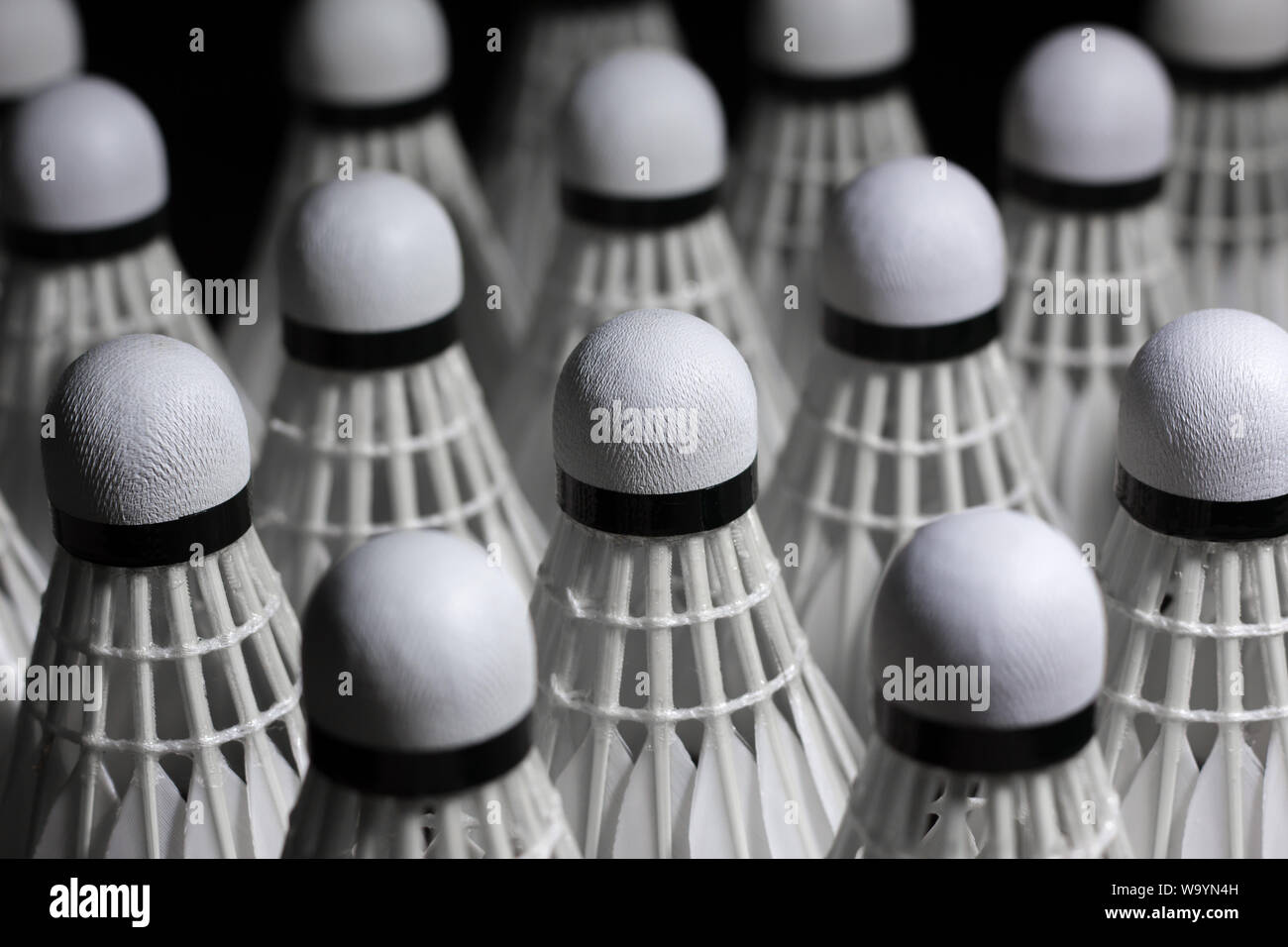 Shuttlecock used in badminton competition on a black background Stock