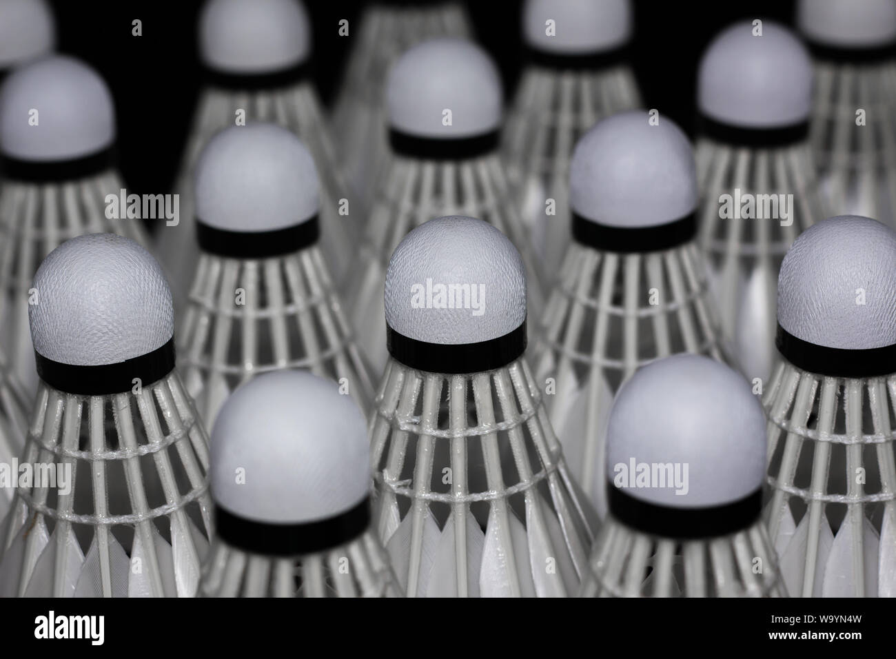 Shuttlecock used in badminton competition on a black background Stock