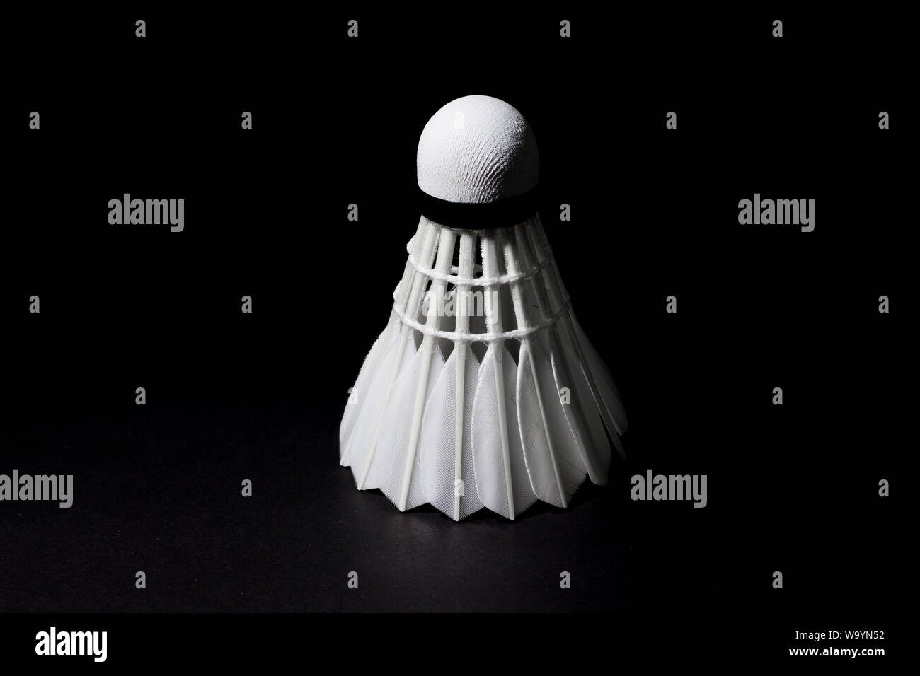 Shuttlecock used in badminton competition on a black background Stock