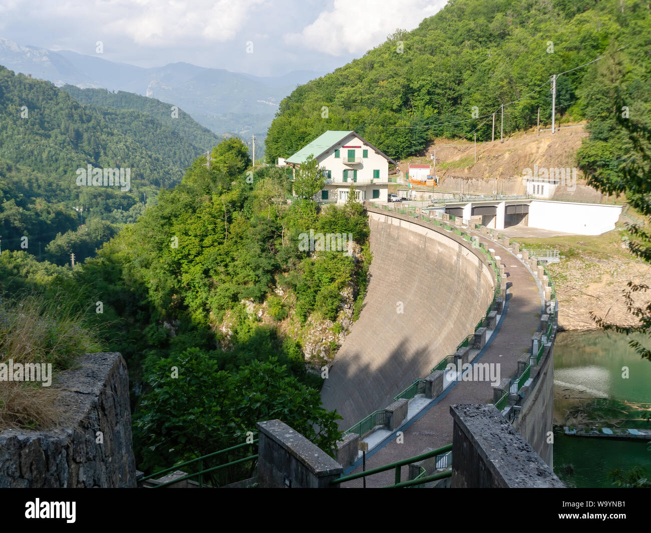 VAGLI SOTTO, LUCCA, ITALY AUGUST 8, 2019: The ENEL dam on Lago Lake Vagli, Garfagnana. Built to provide hydroelectric power, it submerged a village. Stock Photo
