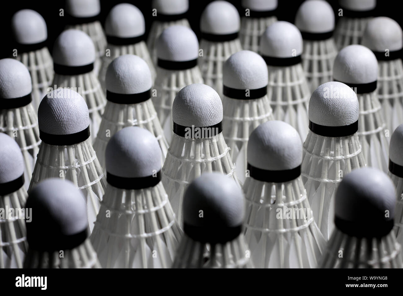 Shuttlecock used in badminton competition on a black background Stock