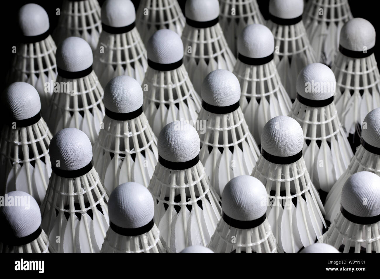Shuttlecock used in badminton competition on a black background Stock
