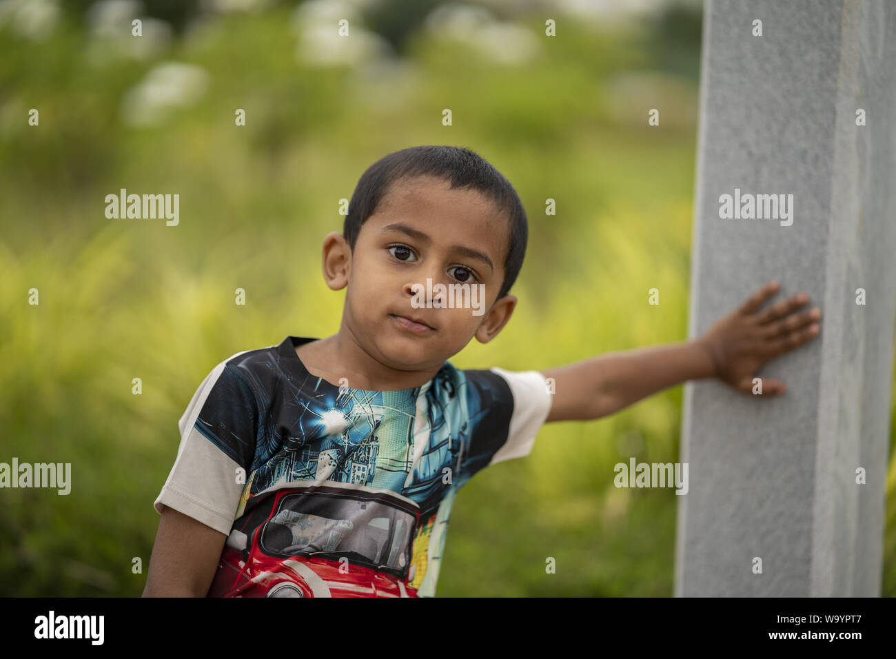 Indian kid closeup standing in park Stock Photo
