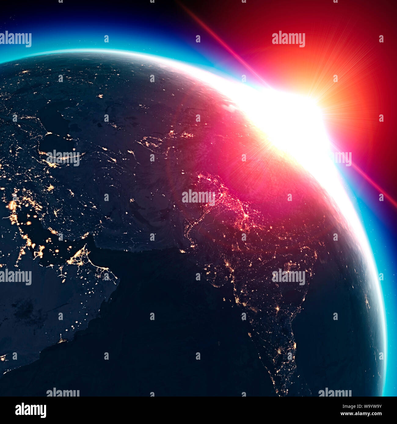 Satellite view of the Earth seen from space. The sun rising over the Middle East, India. Cities illuminated in the night. Sunrise Stock Photo