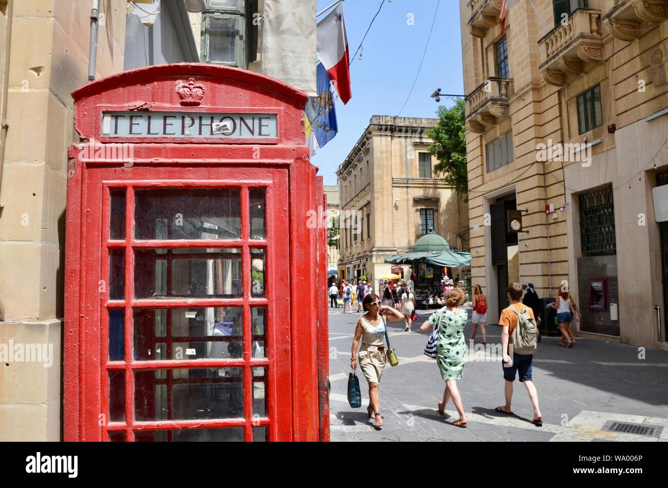 british red telephone box kiosk on republic street valletta malta Stock Photo