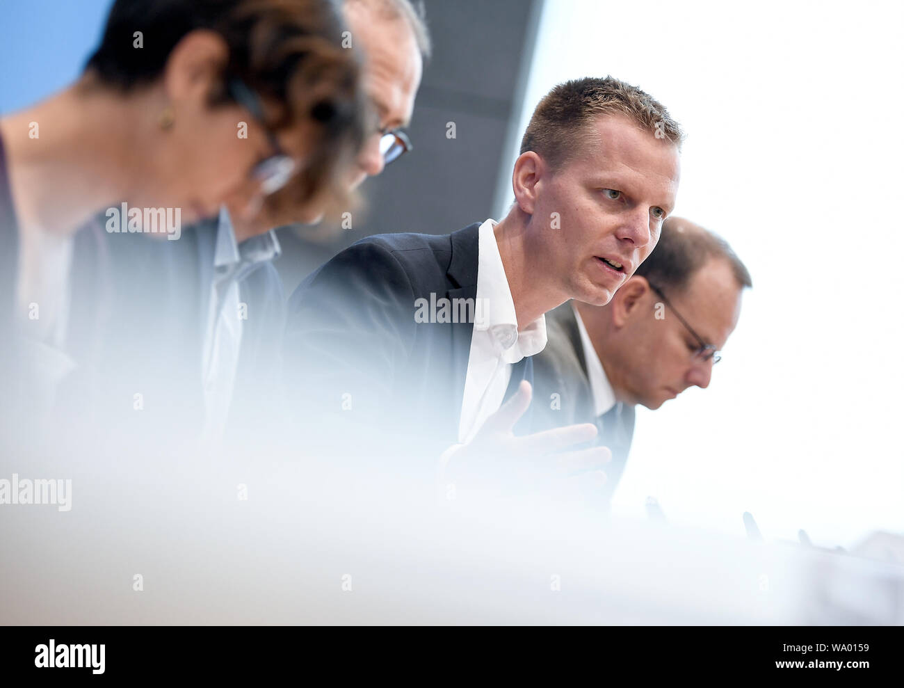 Berlin, Germany. 16th Aug, 2019. Antje von Broock (l-r), Deputy Federal Managing Director of BUND, Martin Kaiser, Managing Director of Greenpeace and Kai Niebert, President of the German Nature Conservation Association, speak at a press conference on the urgency of emergency measures in climate protection. Credit: Britta Pedersen/dpa-Zentralbild/ZB/dpa/Alamy Live News Stock Photo