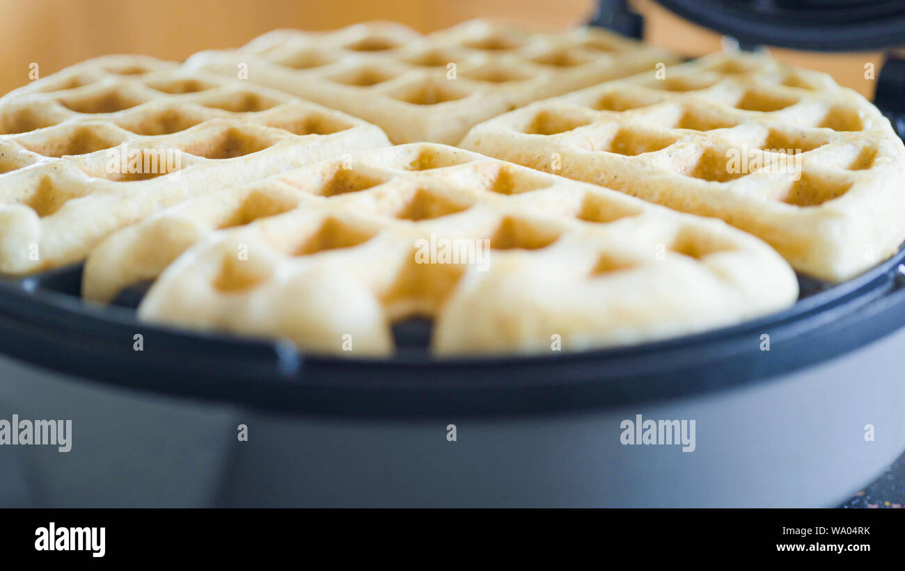 Making homemade waffles in an electric waffle maker Stock Photo Alamy