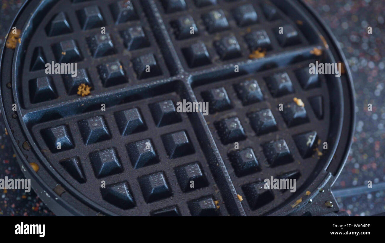 Making homemade waffles in an electric waffle maker Stock Photo Alamy