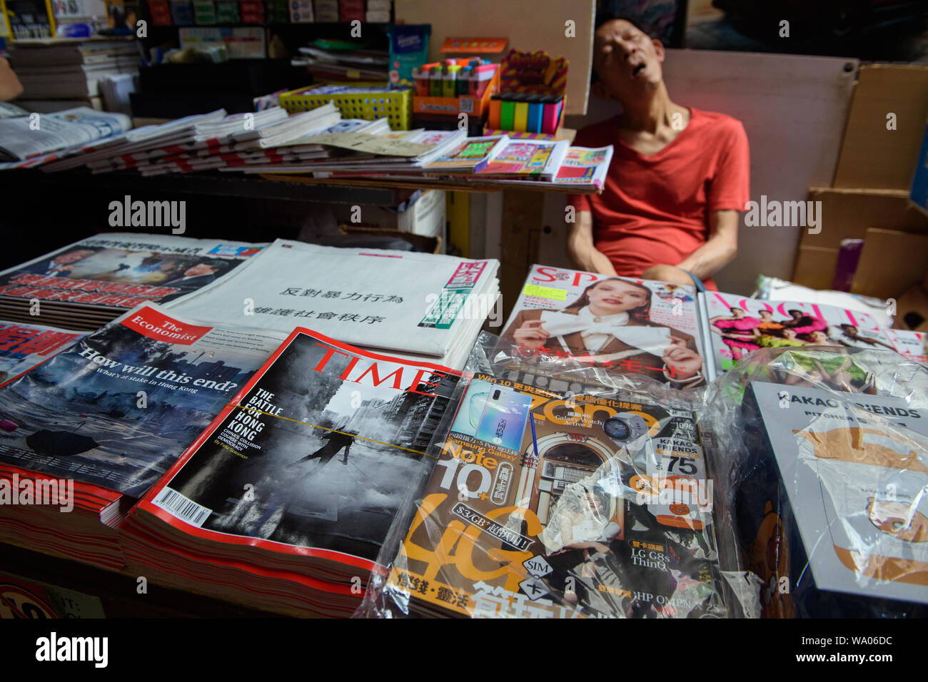Hongkong China 16th Aug 2019 The Magazines Times And The Economist Have The Conflict In Hong Kong On The Cover Of A Roadside Newspaper Stand The Salesman Sleeps In The Background In