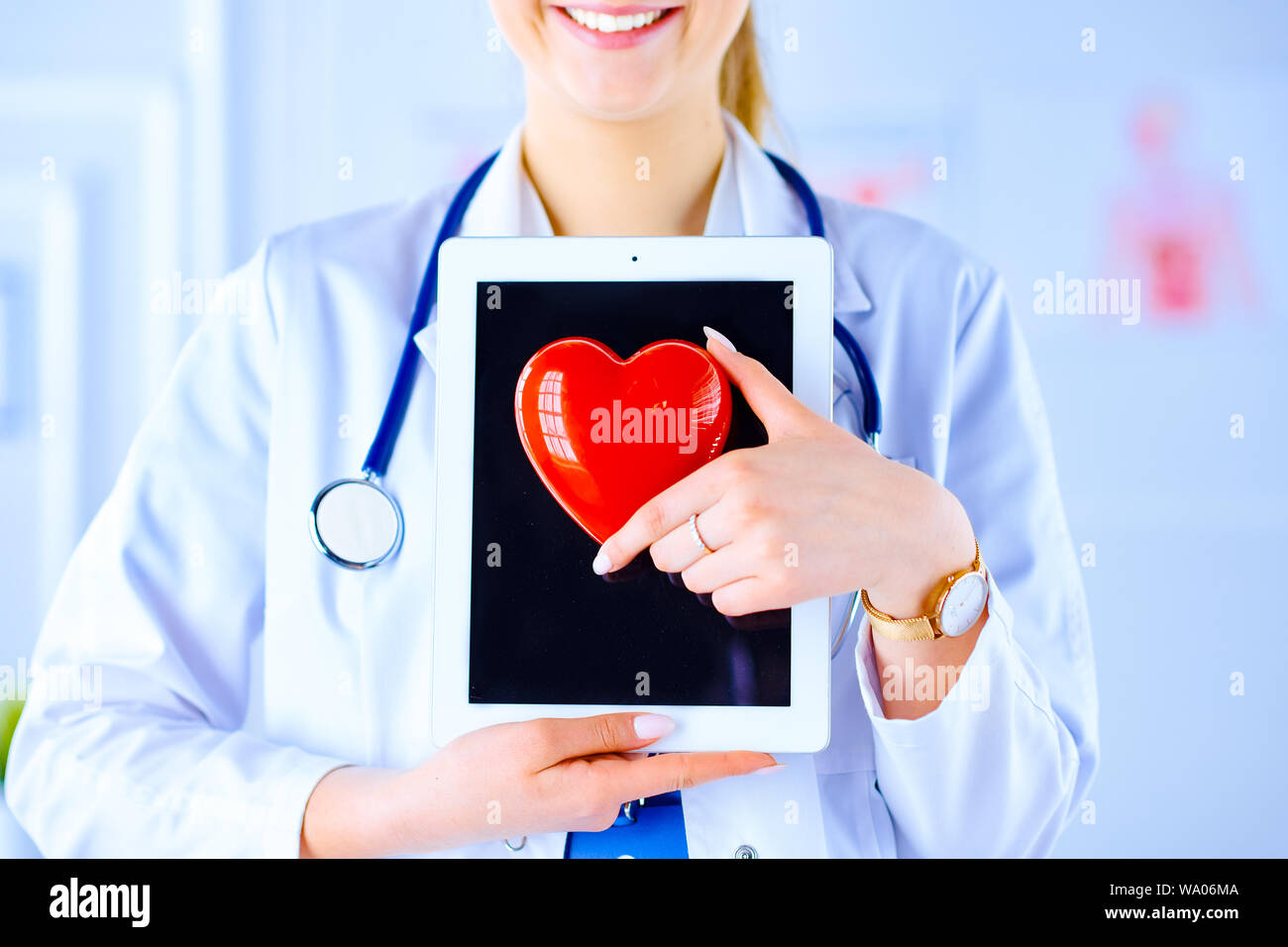 Doctor or medical students with stethoscope using digital tablet and ...