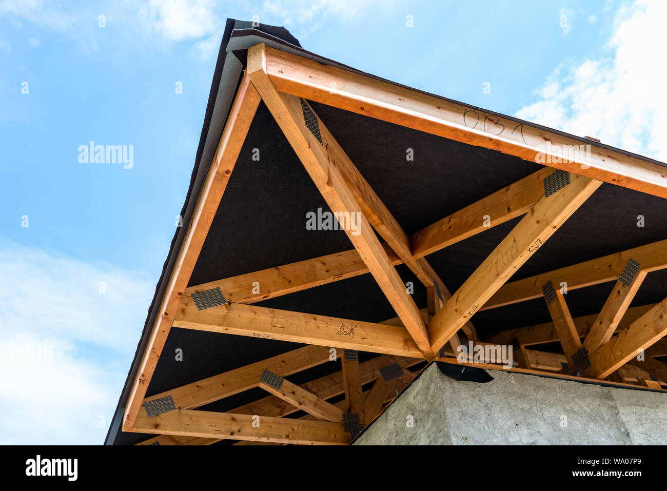 Roof trusses covered with a membrane on a detached house under