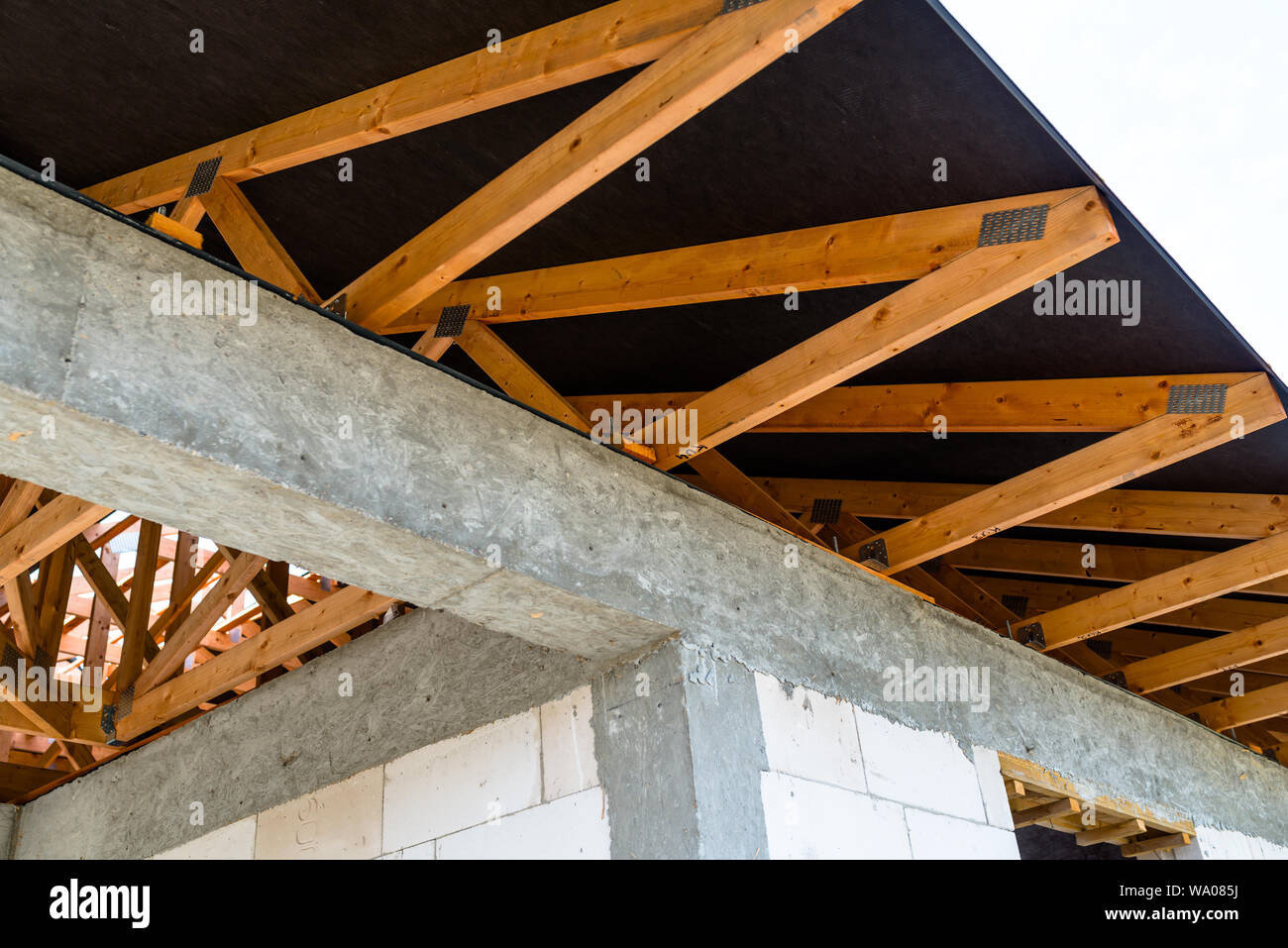 Roof Trusses Covered With A Membrane On A Detached House Under Roof Trusses Covered With A Membrane On A Detached House Under