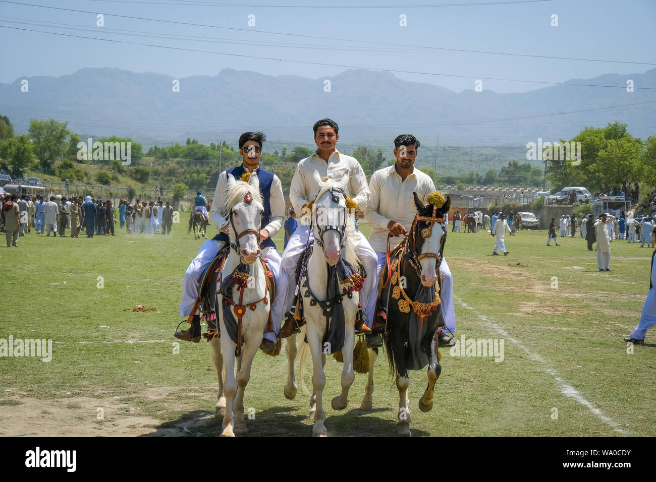 Team of Tent Pegging riders with horses gathered at cultural festival before the competition Stock Photo