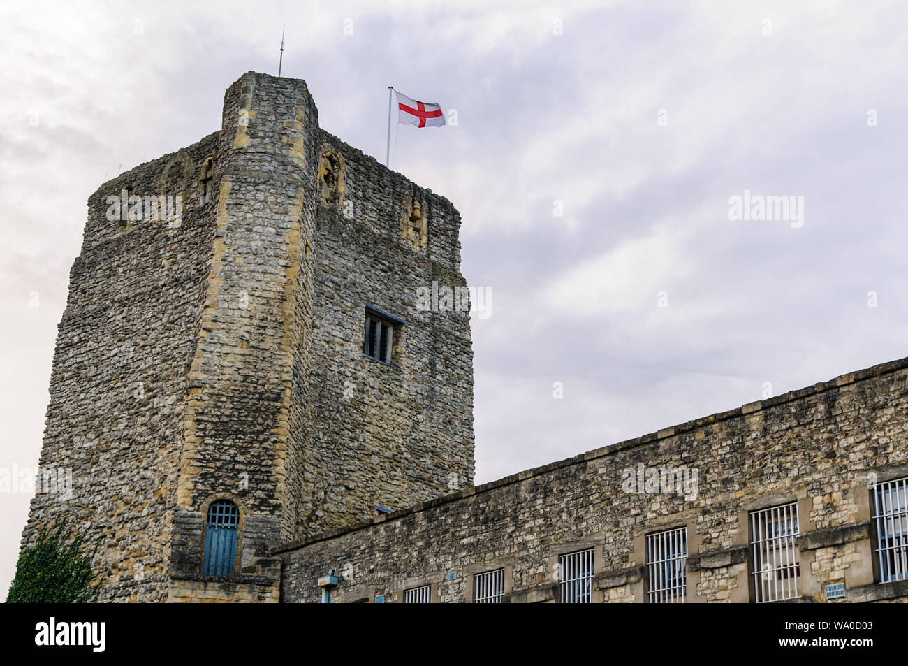 St. George's tower at Oxford Castle flying the english saint George flag on a cloudy day. England Stock Photo