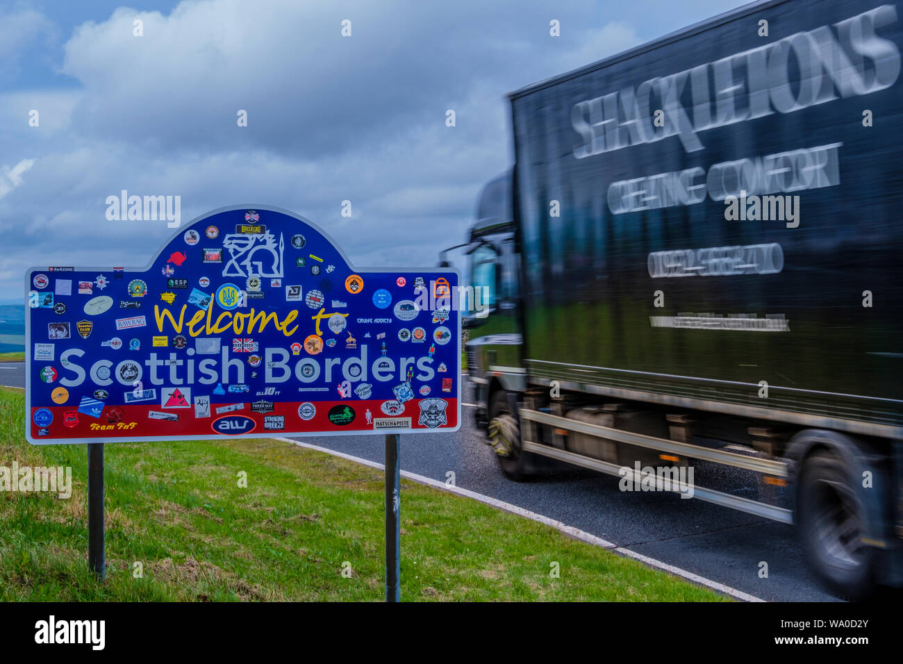 A speeding lorry crosses the border into Scotland on the A68 at Carter Bar. Stock Photo