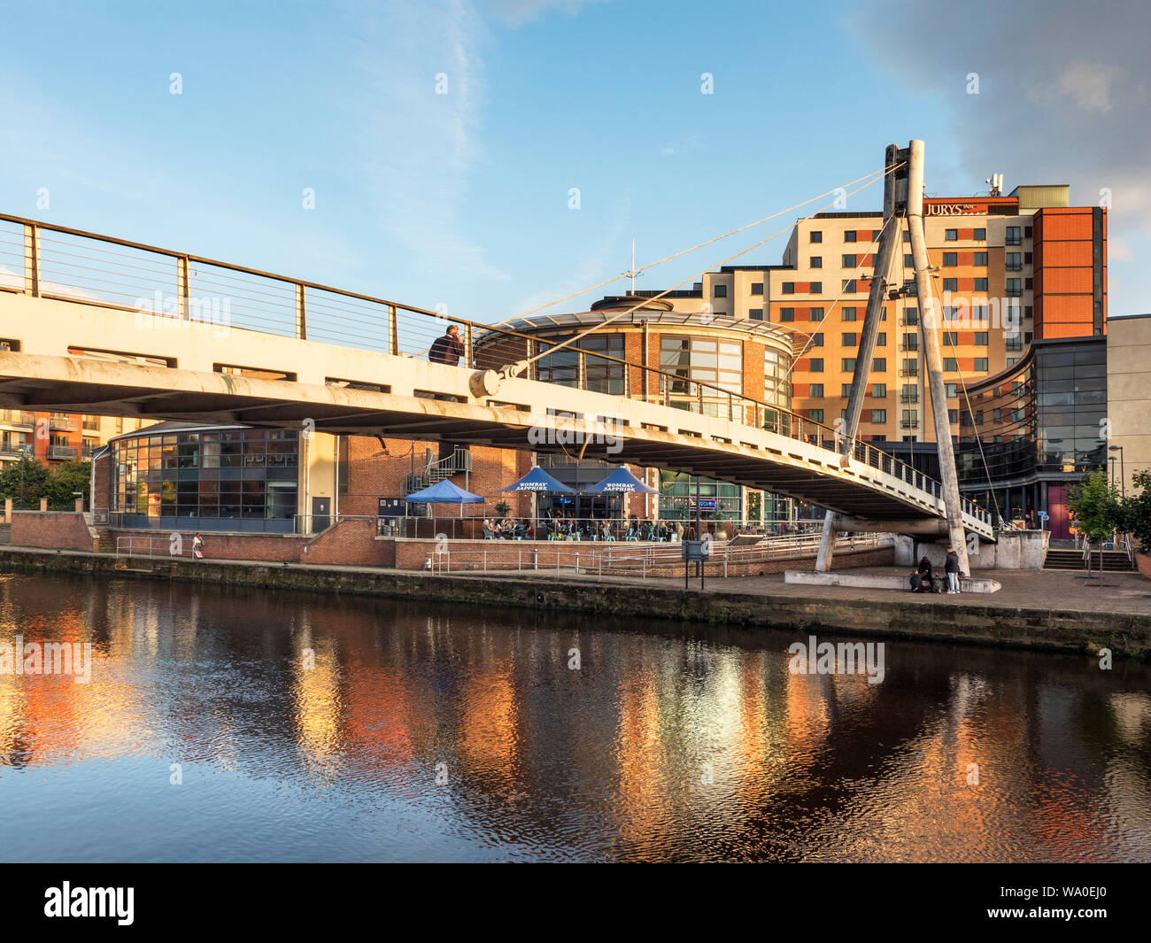 Centenary Bridge pedestrian suspension bridge over the River Aire and Brewery Wharf in Leeds West Yorkshire England Stock Photo