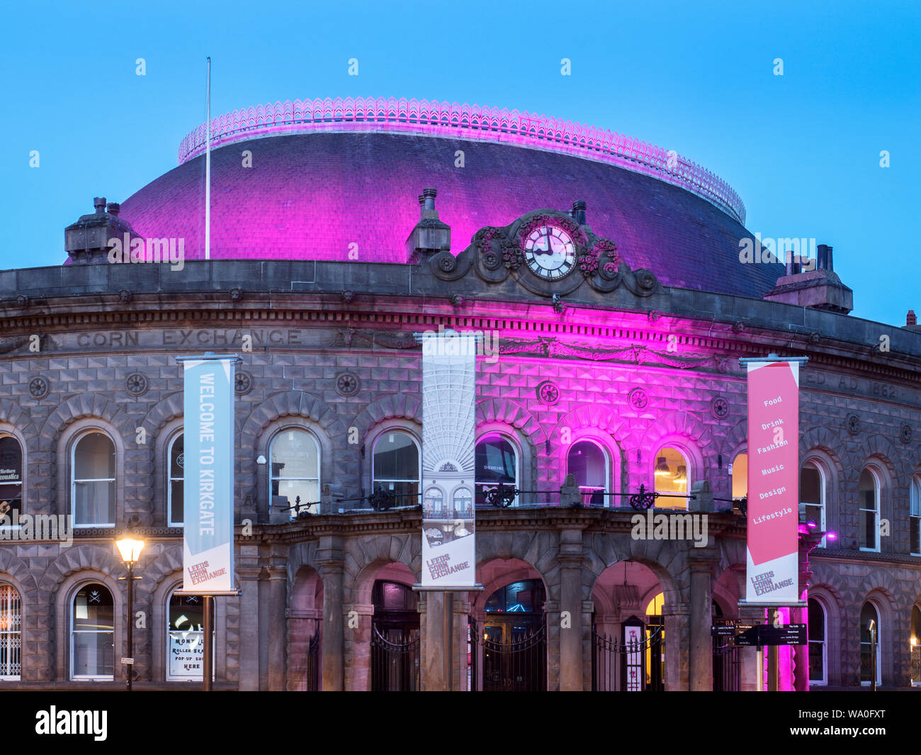 The Corn Exchange illuminated by purple lights at dusk Leeds West