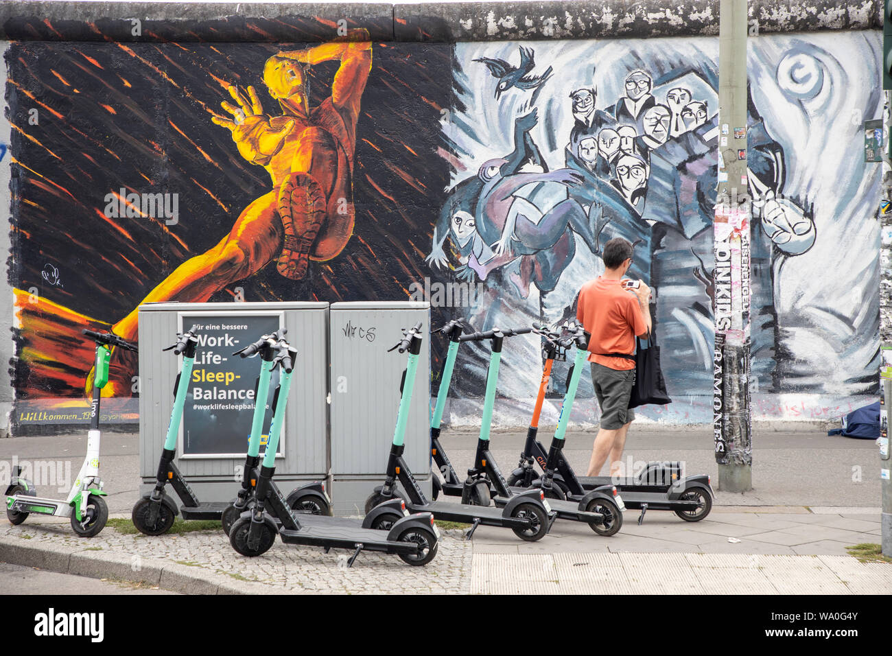 Eastside Galery, e-scooter, electric scooter, rental scooter, in Berlin, parking at the roadside, sidewalk, Stock Photo