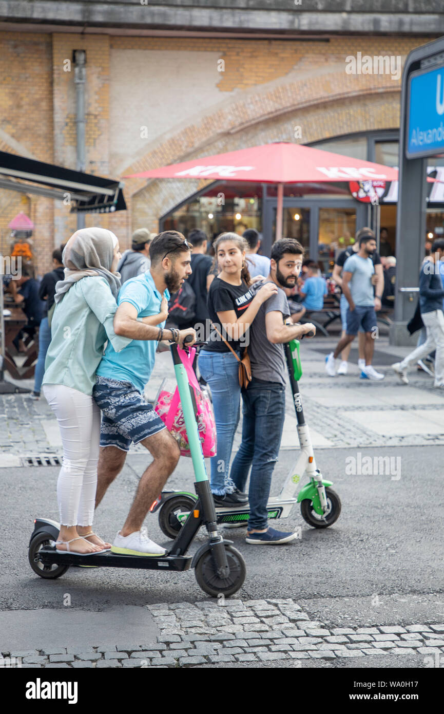 E-scooter, electric scooter, rental scooter, tourists, partly in pairs on the in Berlin Stock Photo Alamy
