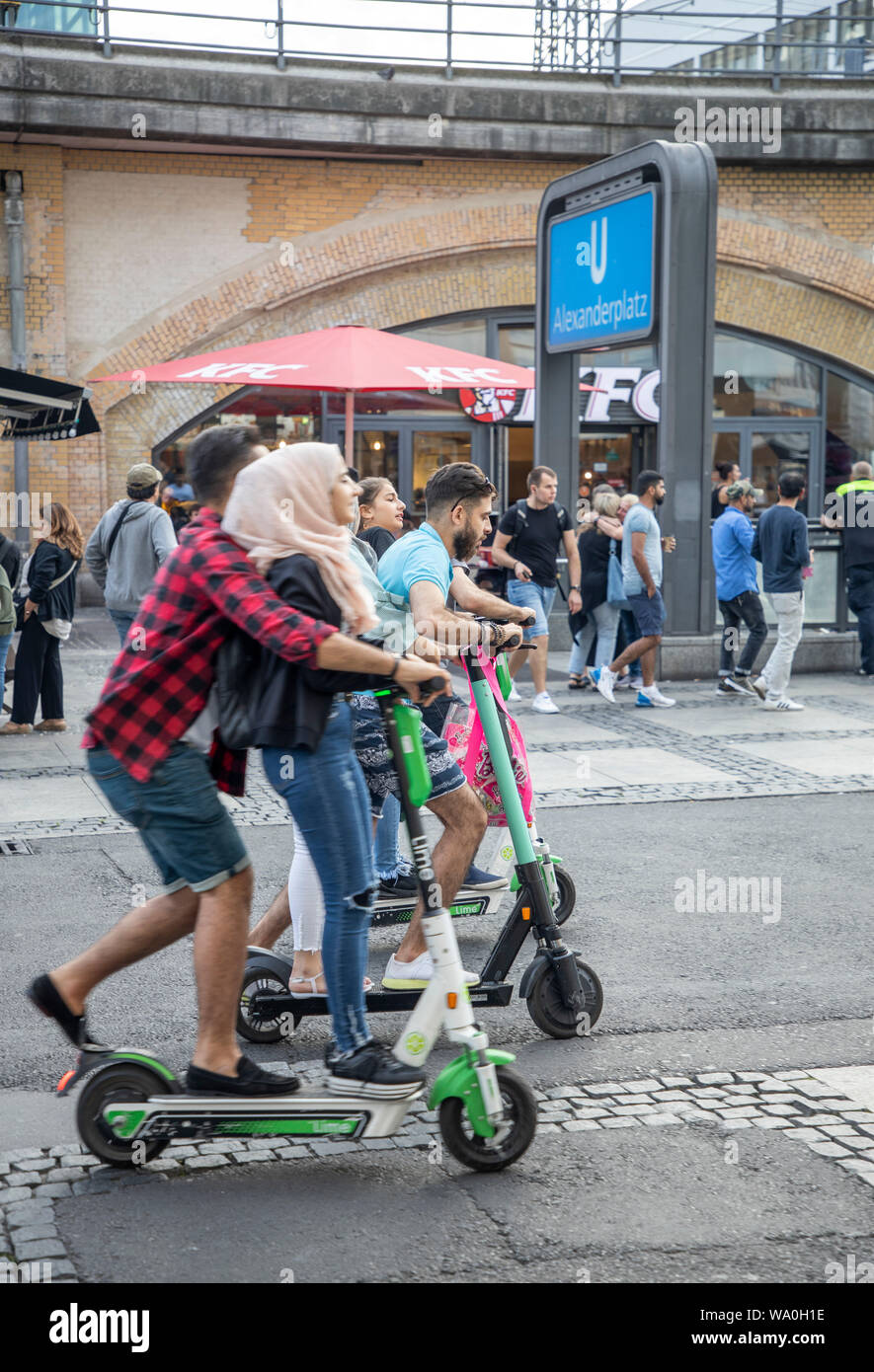 E-scooter, electric scooter, rental scooter, tourists, partly in pairs on  the scooter, in Berlin Stock Photo - Alamy