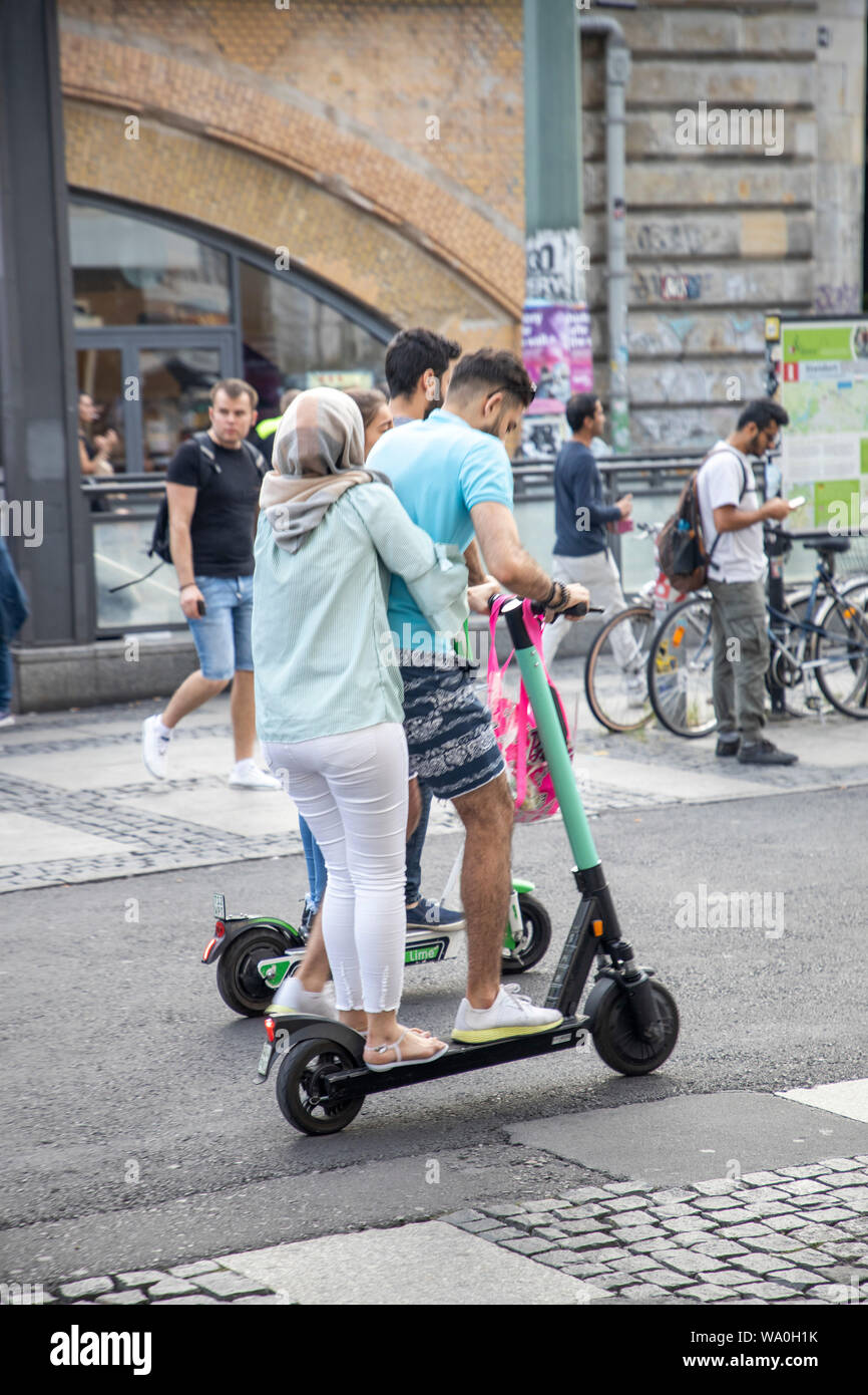 Jo da tøffel deres E-scooter, electric scooter, rental scooter, tourists, partly in pairs on  the scooter, in Berlin Stock Photo - Alamy