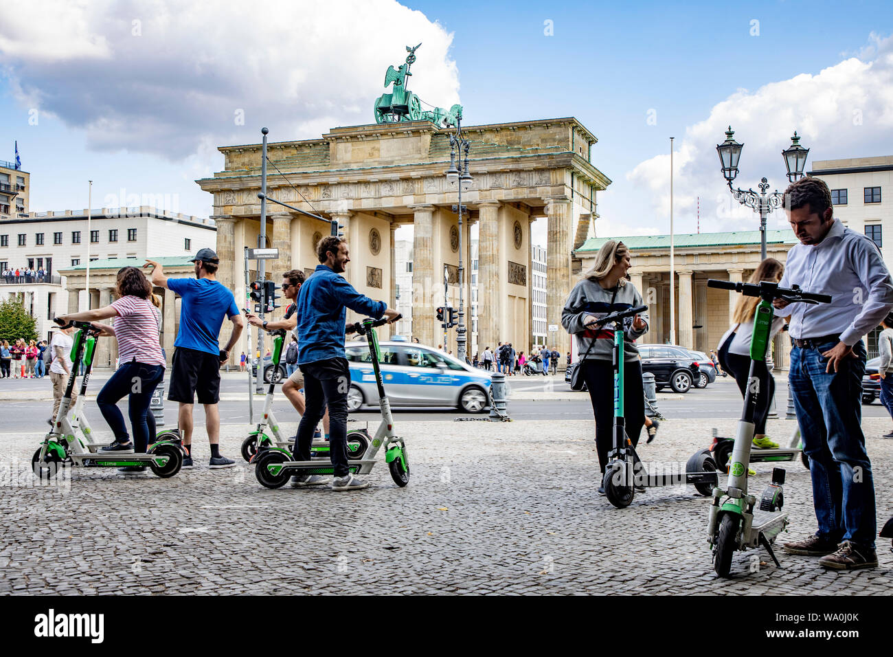 electric scooter, in front of the Brandenburg Gate in Berlin, Stock Photo