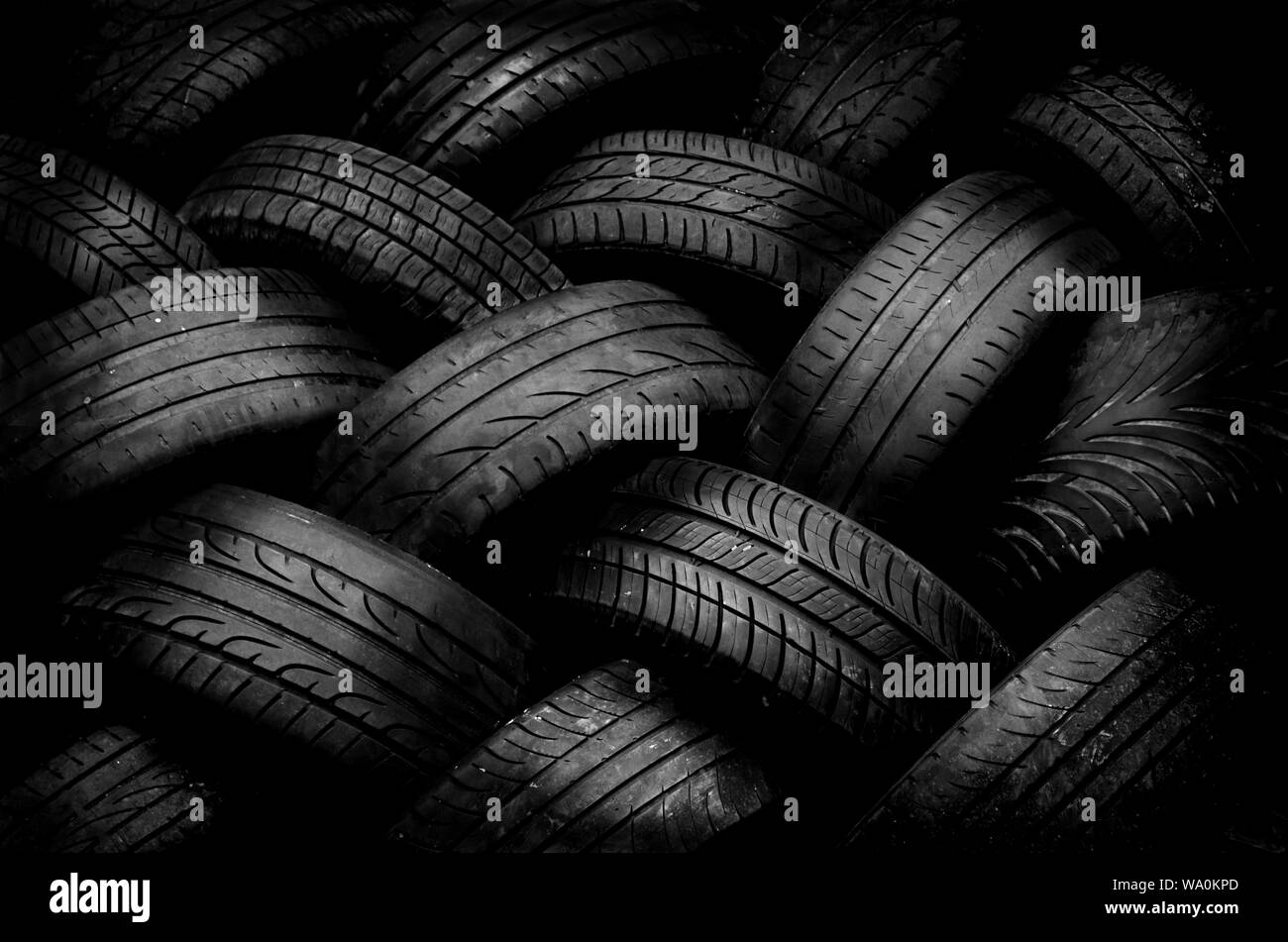 Patterns Using Tyres Still life capturing the patterns and textures of stacked used car ...