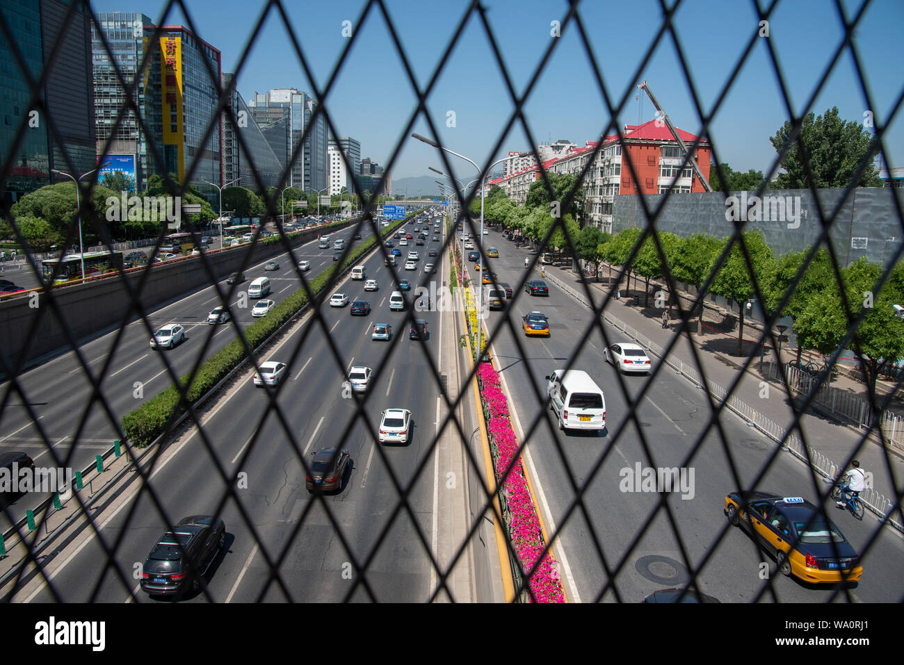 Beijing, China – June 4 2019: Cars moving fast on a busy multi lane highway in city of Beijing in China Stock Photo