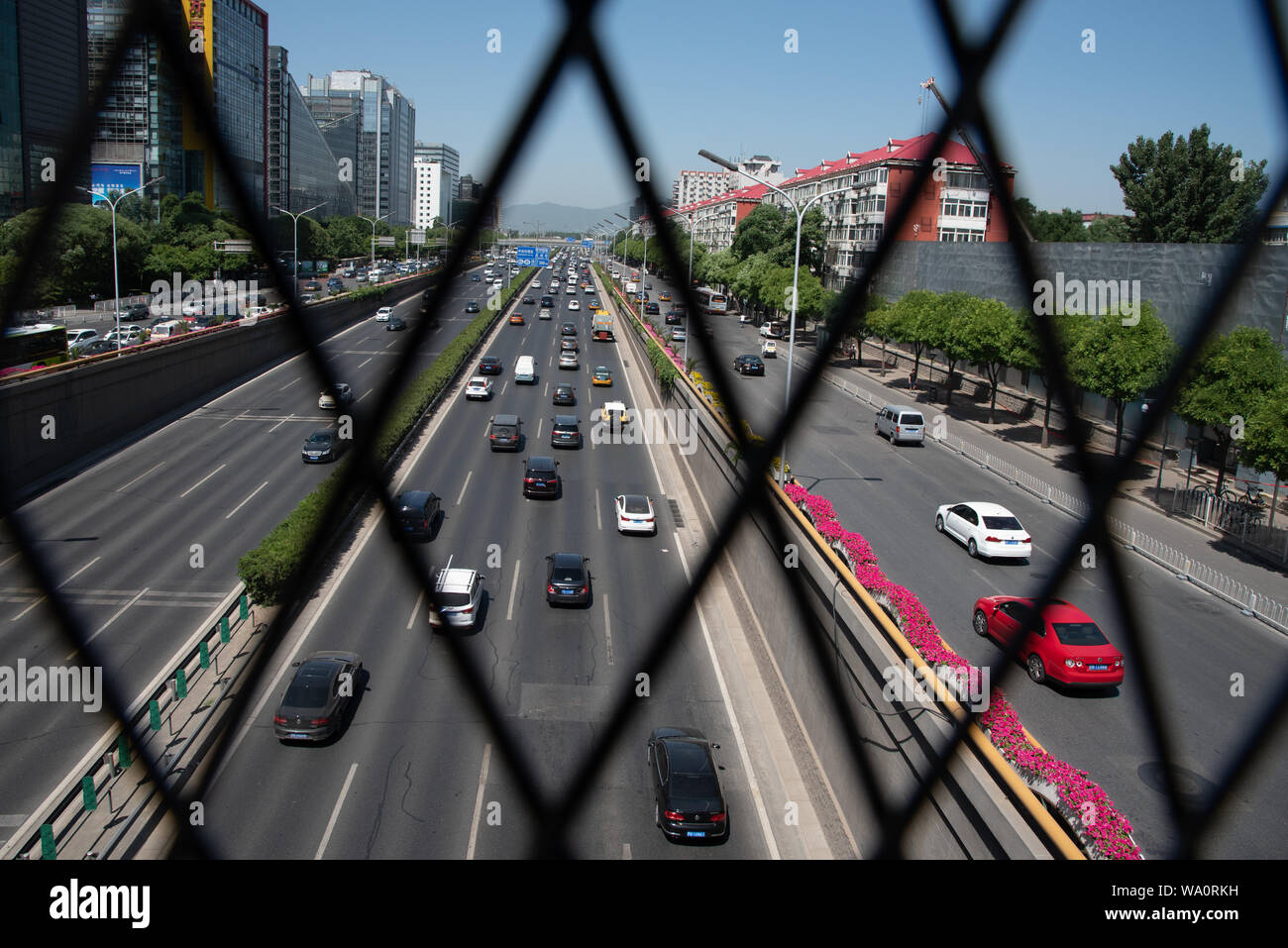 Beijing, China – June 4 2019: Cars moving fast on a busy multi lane highway in city of Beijing in China Stock Photo