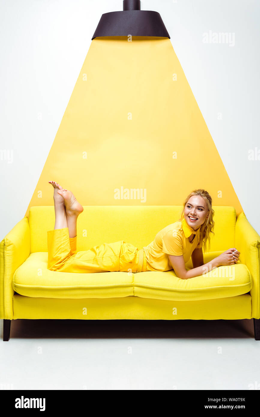 Barefoot girl lying on sofa hi-res stock photography and images - Alamy