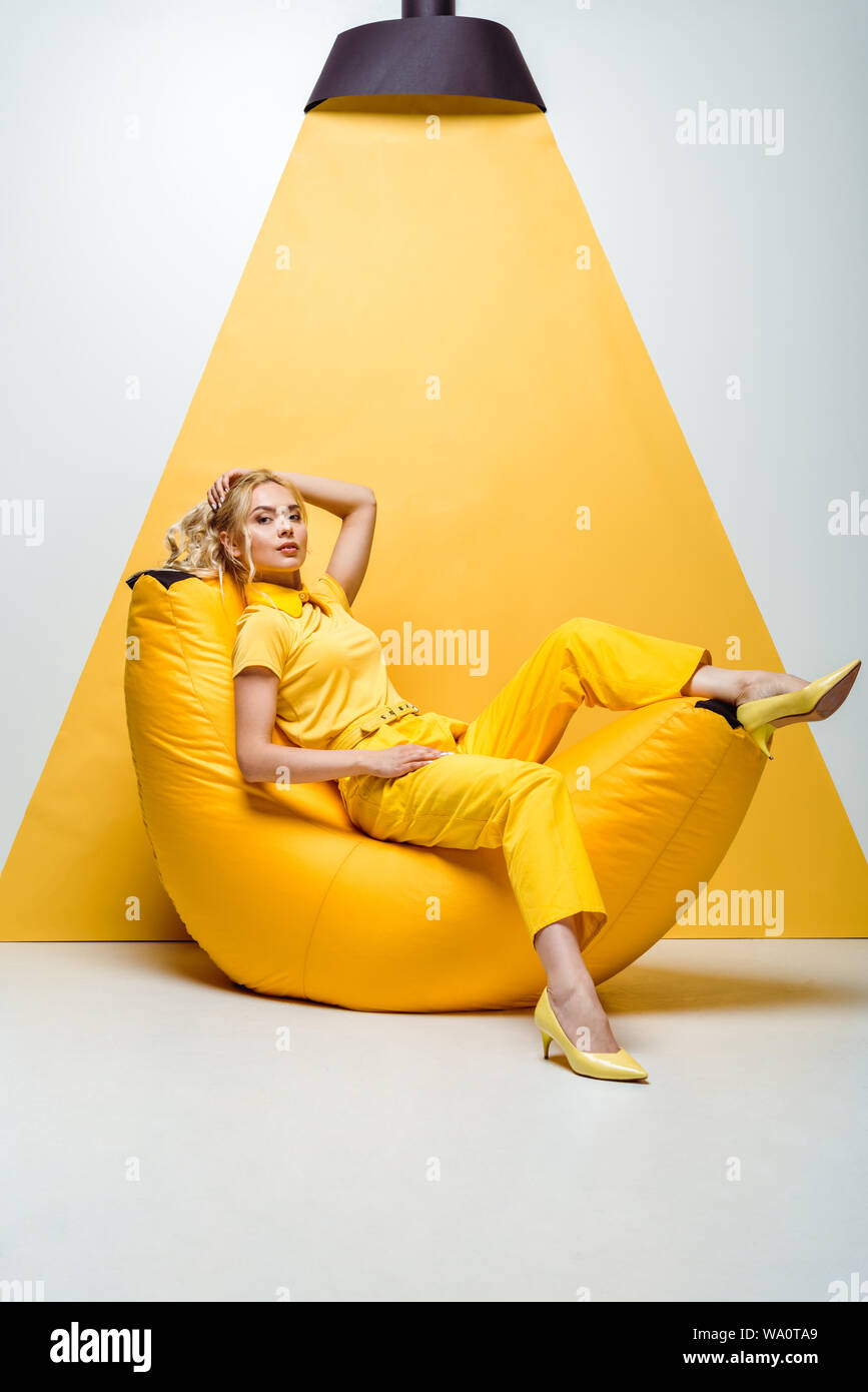Girl sitting on bean bag hi-res stock photography and images - Alamy