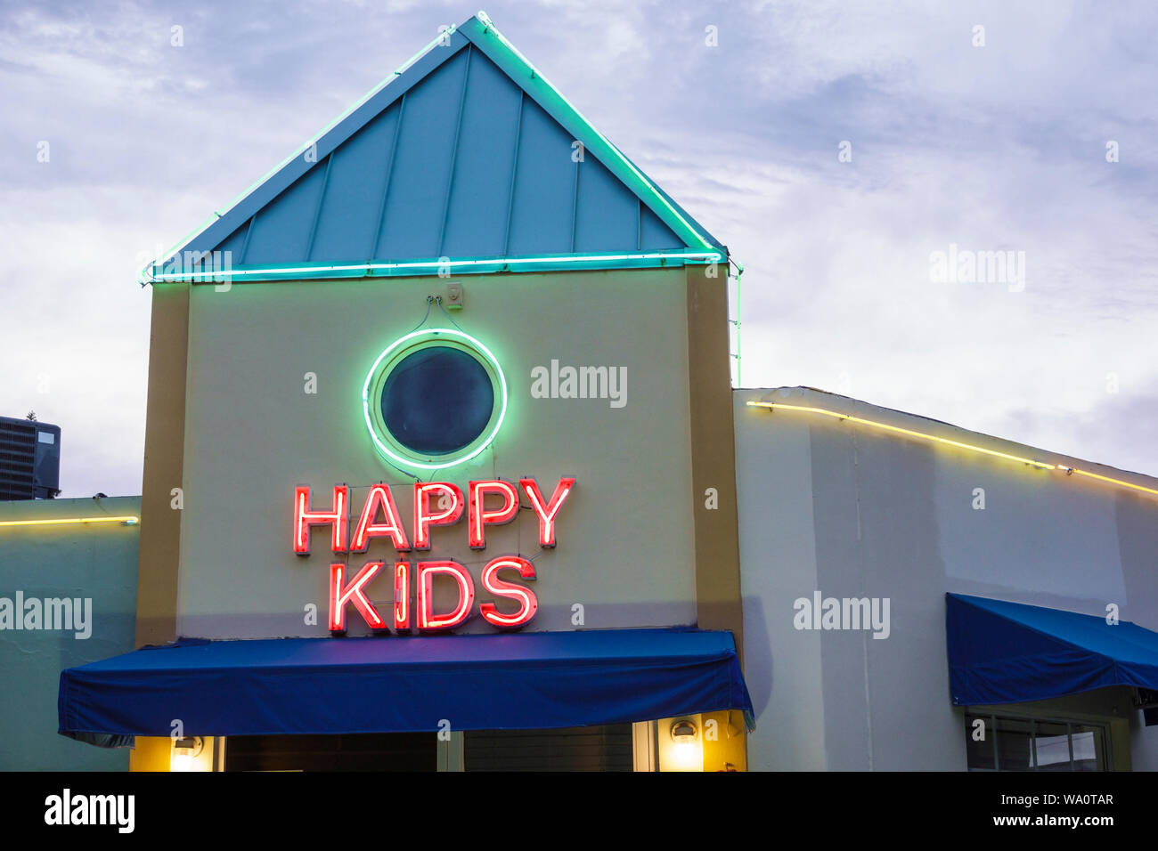 Miami Beach Florida Happy Kids neon sign daycare center centre Stock