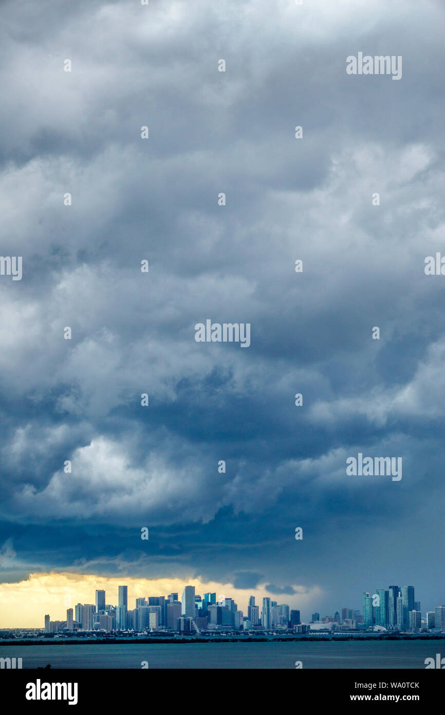 Miami Beach Florida,dark clouds weather sky storm clouds gathering,rain,city skyline,Biscayne Bay,FL190731011 Stock Photo