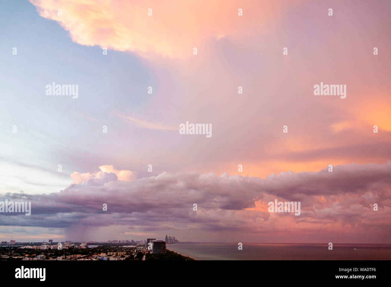 Miami Beach Florida,Atlantic Ocean,clouds weather sky,sunset dusk,storm clouds,rain,FL190731022 Stock Photo