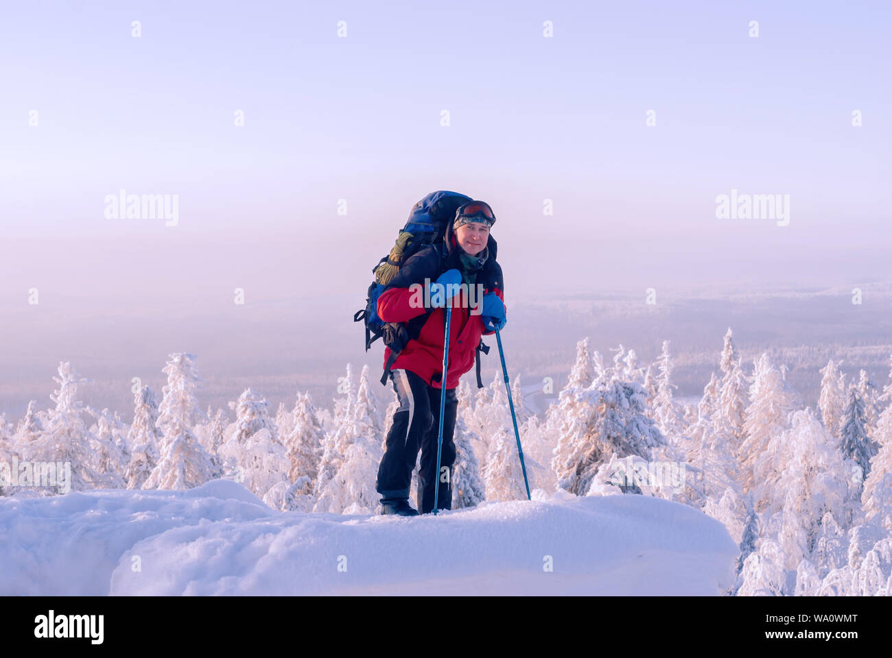 Woman with Backpack Sliding Down on Snow Covered Hiking Trail with  Panoramic View on Snowcapped Mountain Peak Kreiskogel Stock Photo - Image  of recreation, backpacker: 265315204