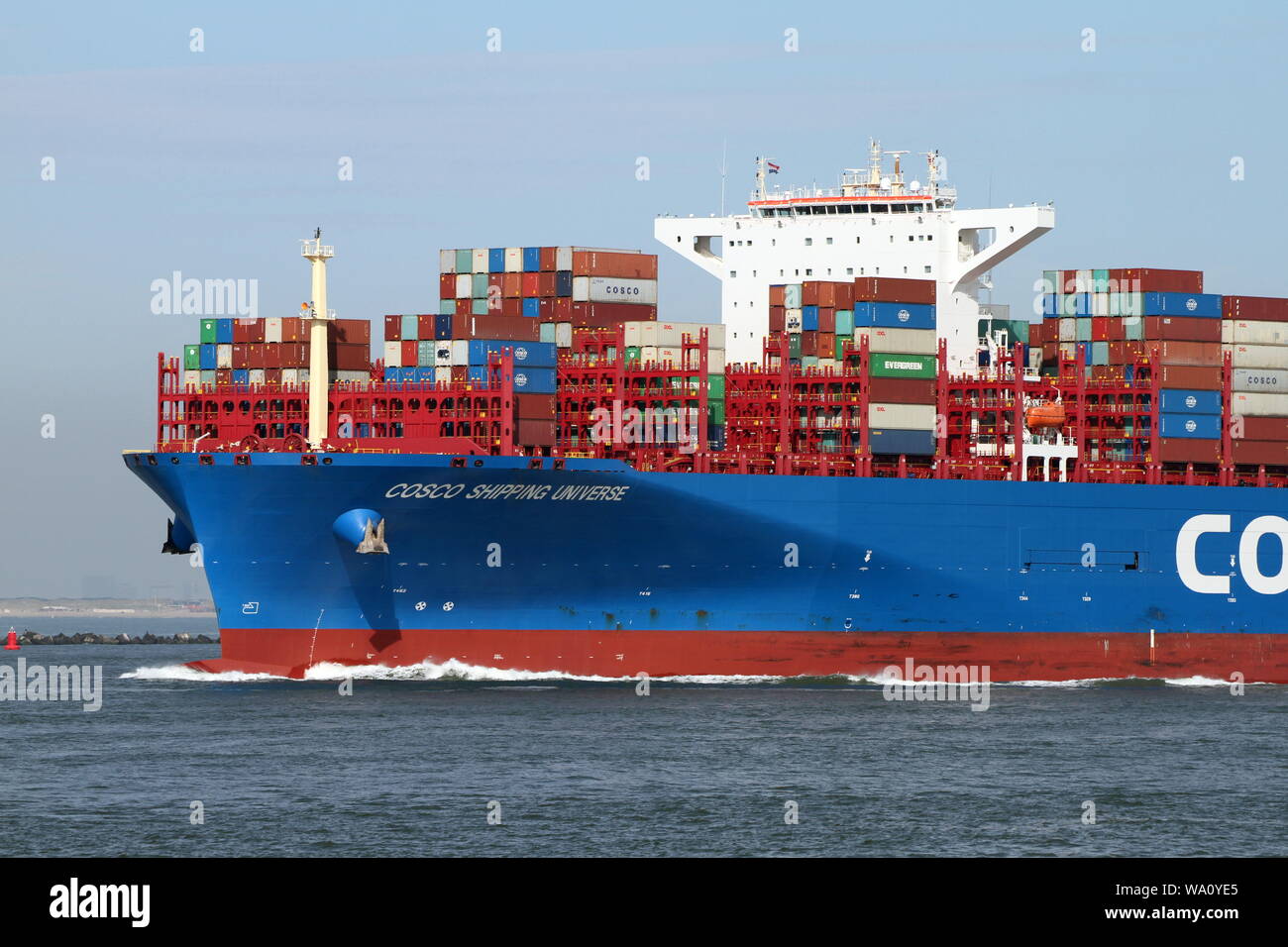 The container ship COSCO Shipping Universe leaves the port of Rotterdam on 22 May 2019. Stock Photo