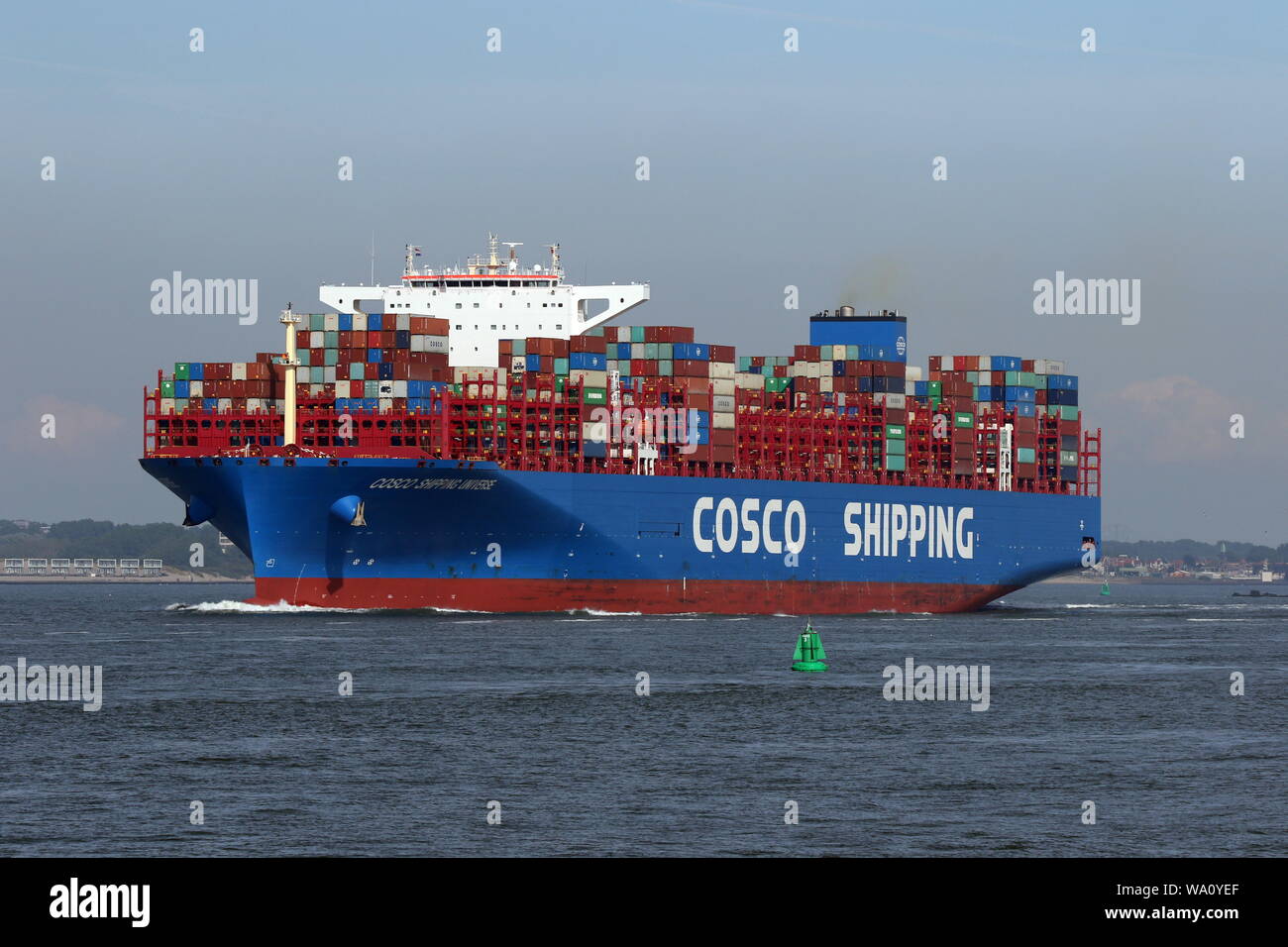 The container ship COSCO Shipping Universe leaves the port of Rotterdam on 22 May 2019. Stock Photo
