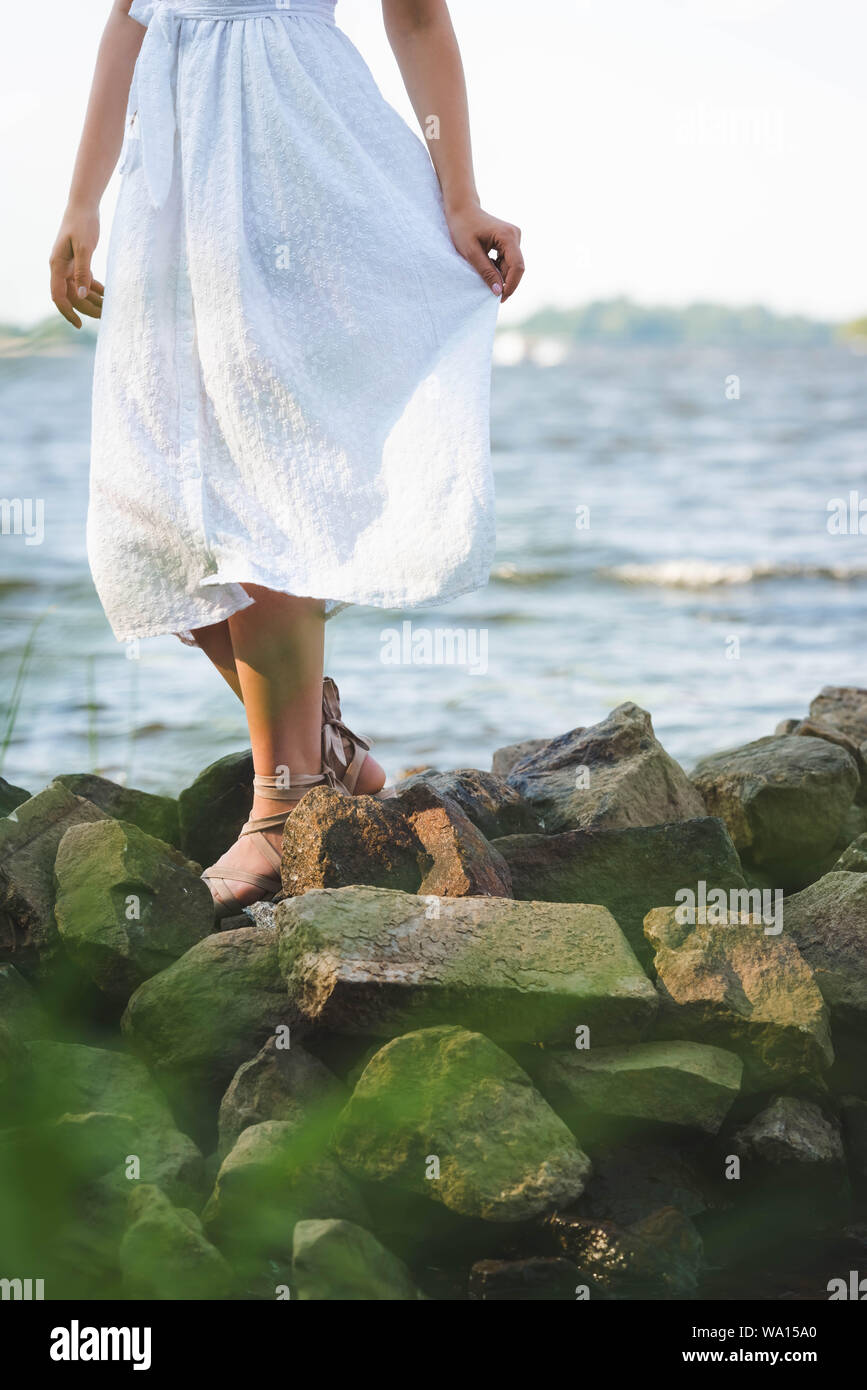 white dress by the shore