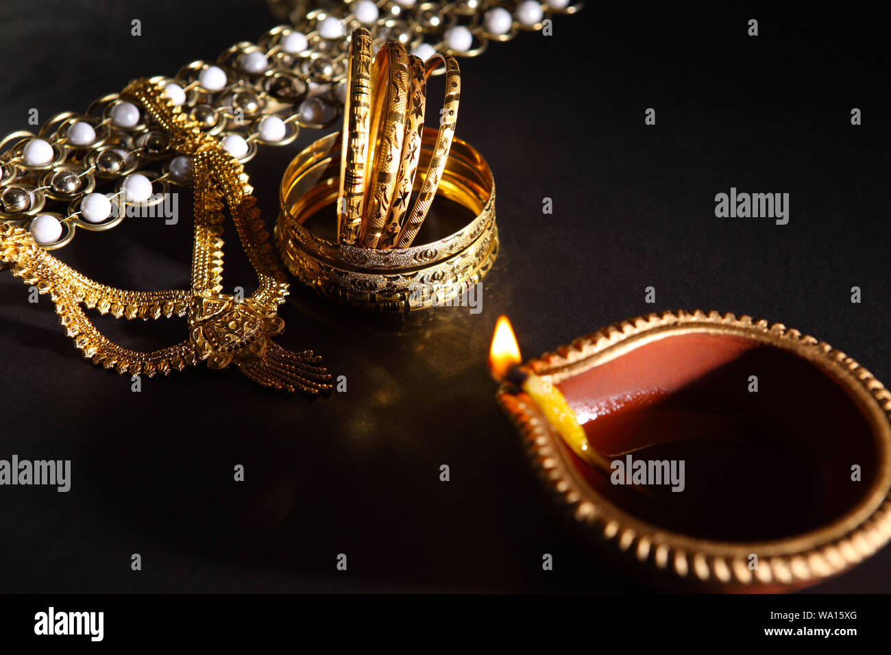 Oil lamp near jewelry Stock Photo Alamy