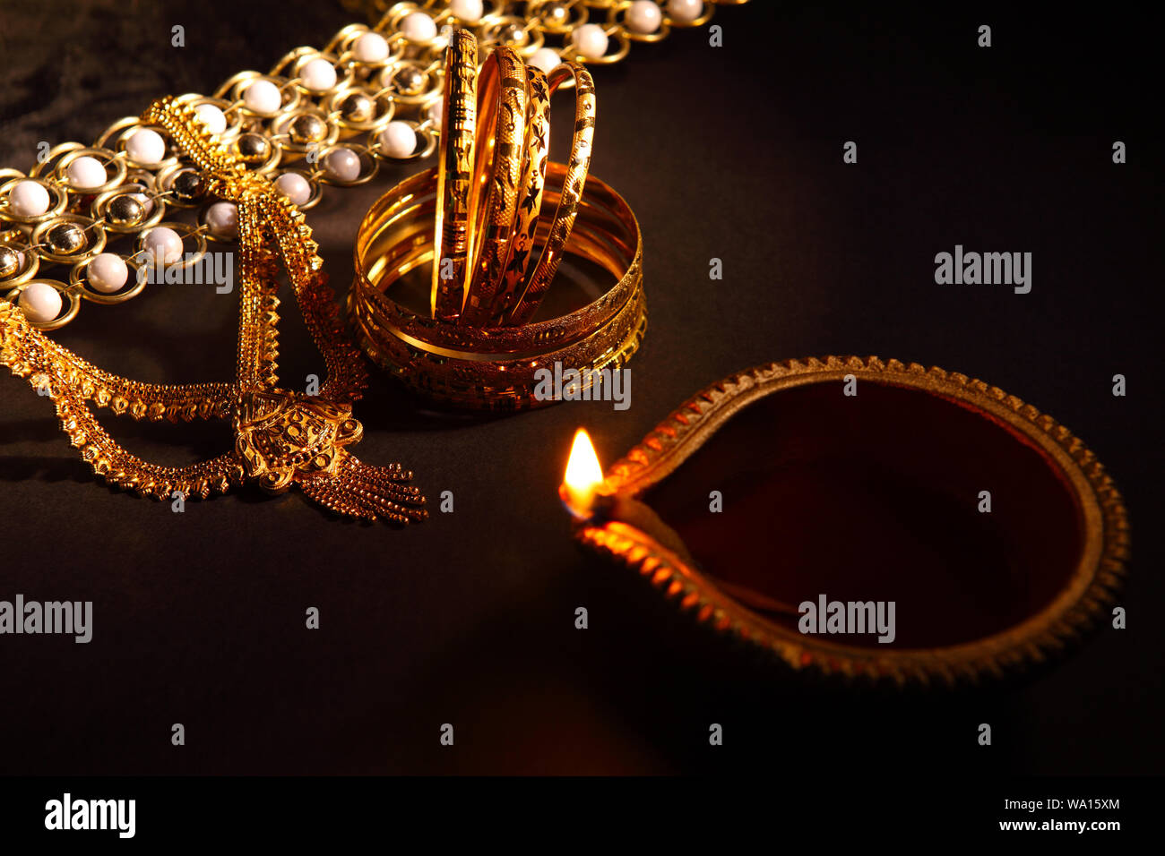 Oil lamp near jewelry Stock Photo Alamy