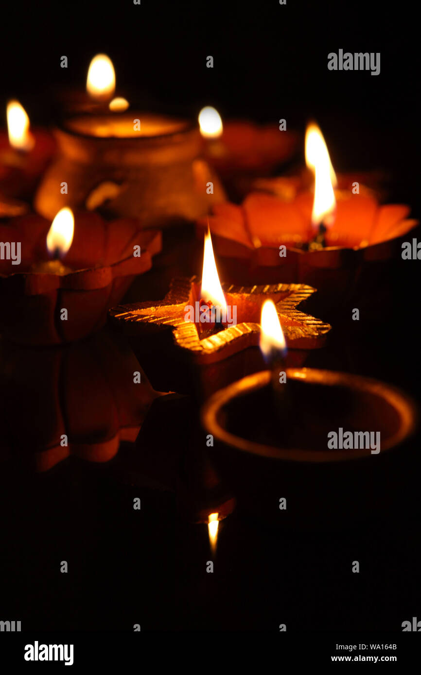 Assorted oil lamps burning Stock Photo Alamy