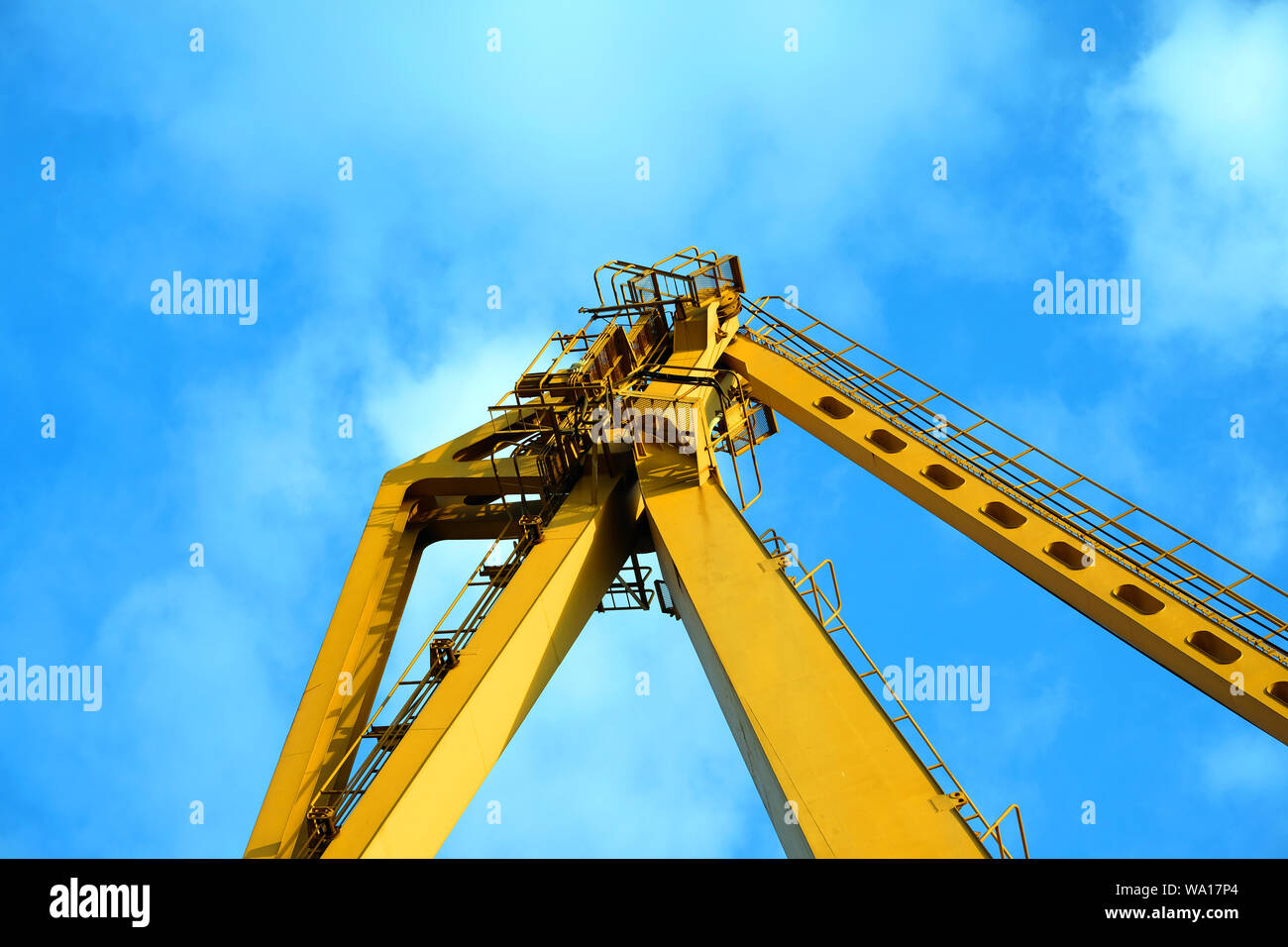 Industrial Crane operating and lifting an electric generator Stock