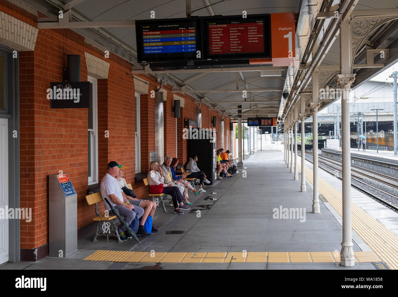Passengers waiting for train on platform at South Brisbane Railway Station, Brisbane, Queensland, Australia Stock Photo