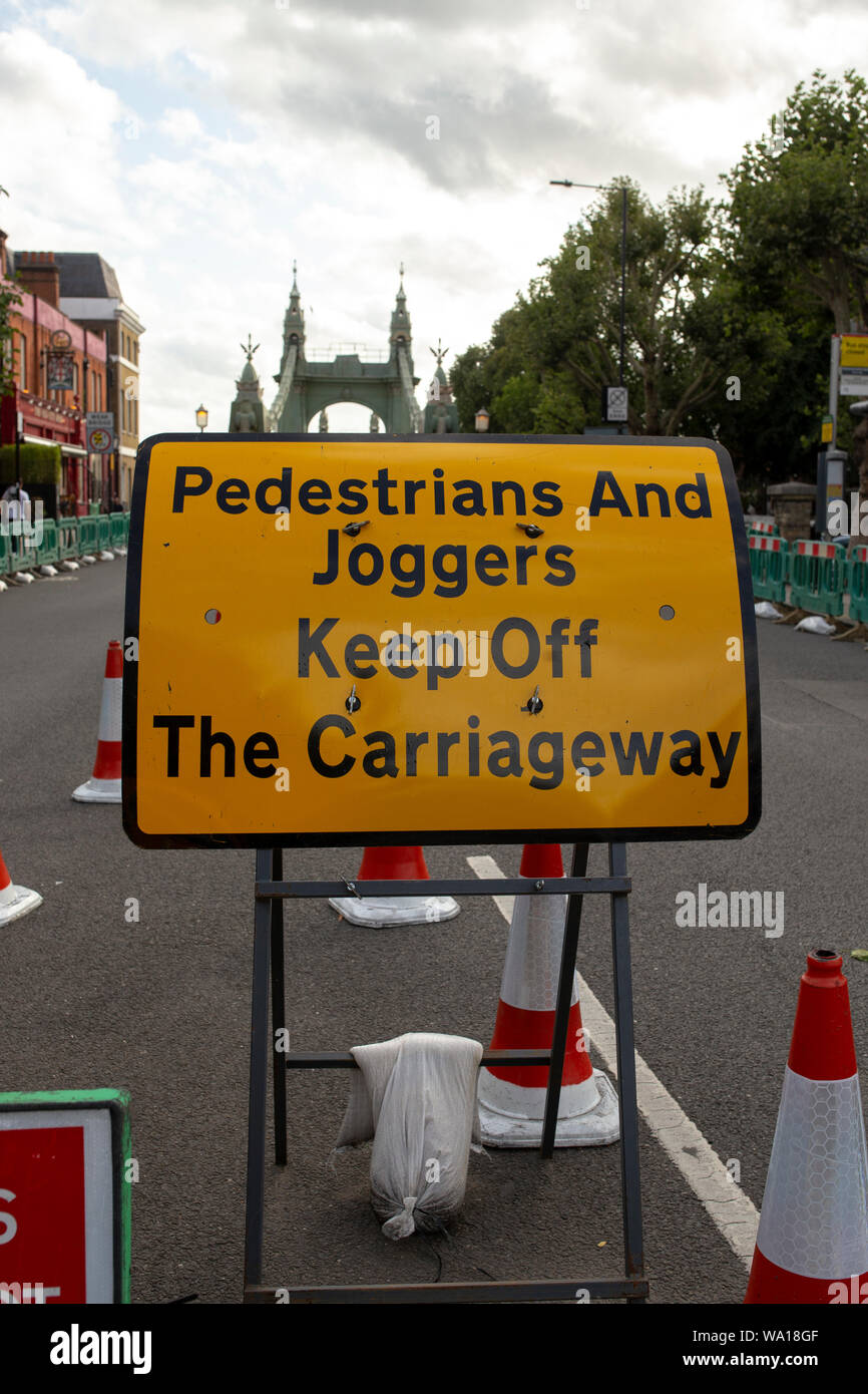 Sign stating road leading to Hammersmith Bridge is closed to pedestrians. Stock Photo
