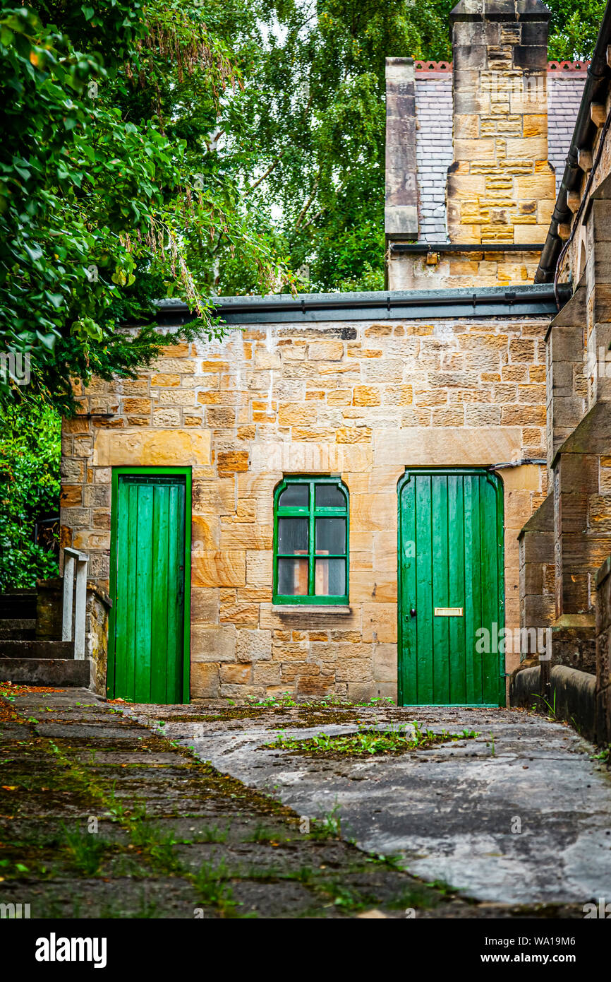 Green doors in am old stone building near Consett, County Durham, England, UK Stock Photo Alamy
