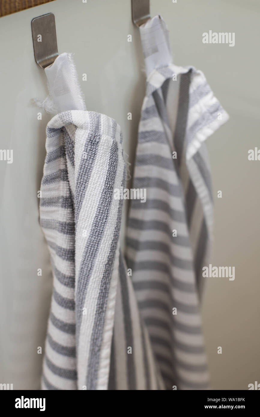 Two Kitchen Towels Hanging On A Hooks In A Kitchen Close Up Stock Photo Alamy
