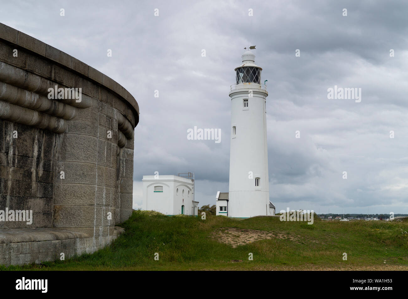 Hurst Point Lighthouse with the eastern end of Hurst Castle in the foreground. Stock Photo